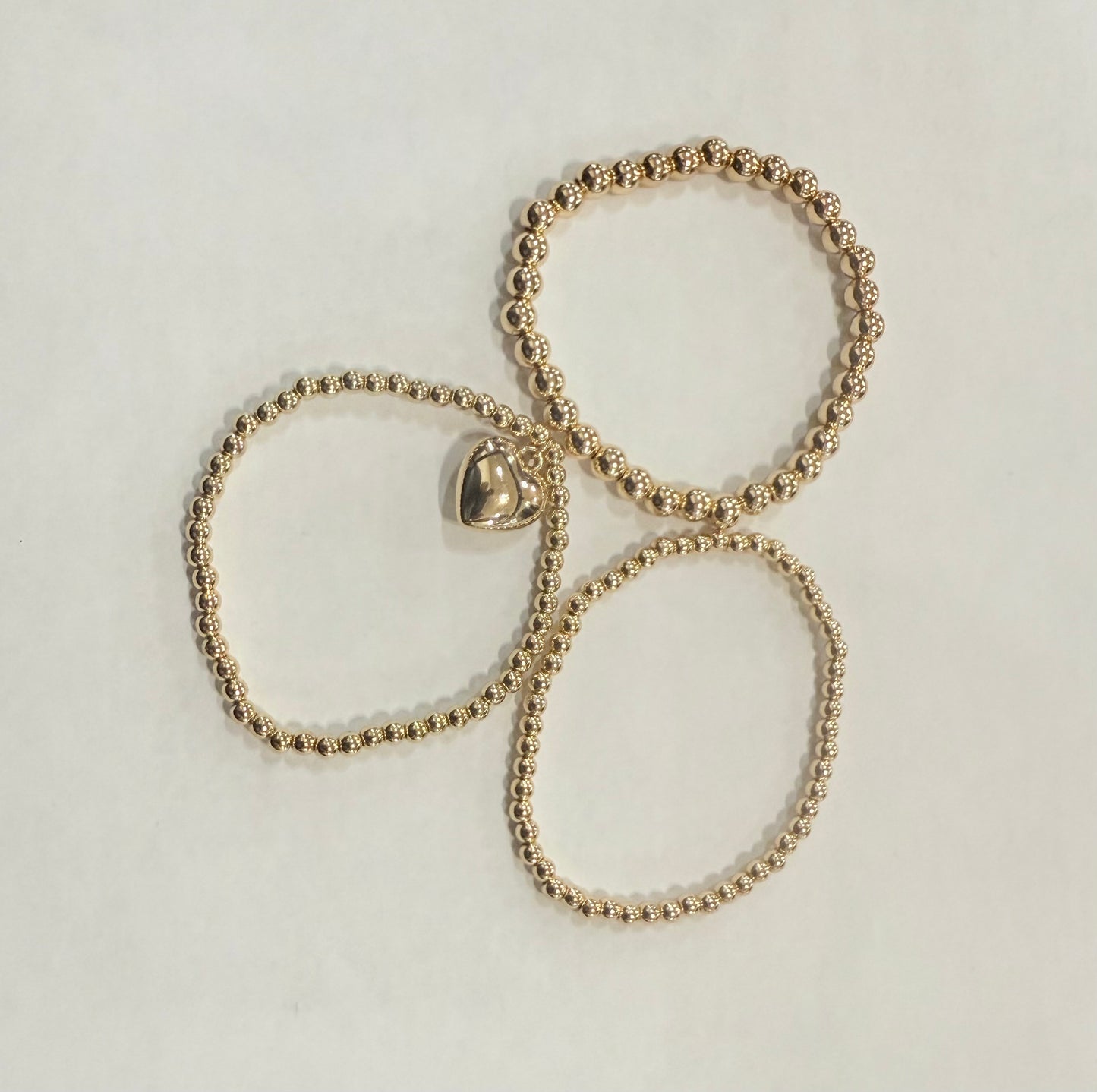 Three-Strand Heart Charm Bracelet – La Tour Salon of Paris
